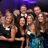 Guests in a huddle at Enrichment.